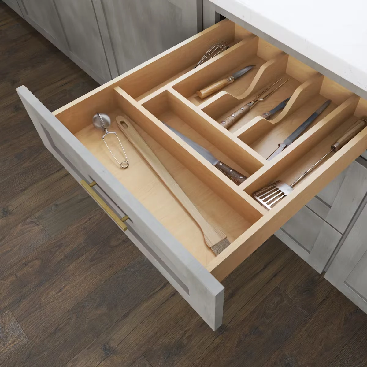 Fabuwood modular maple drawer inserts arranged for cutlery and utensils