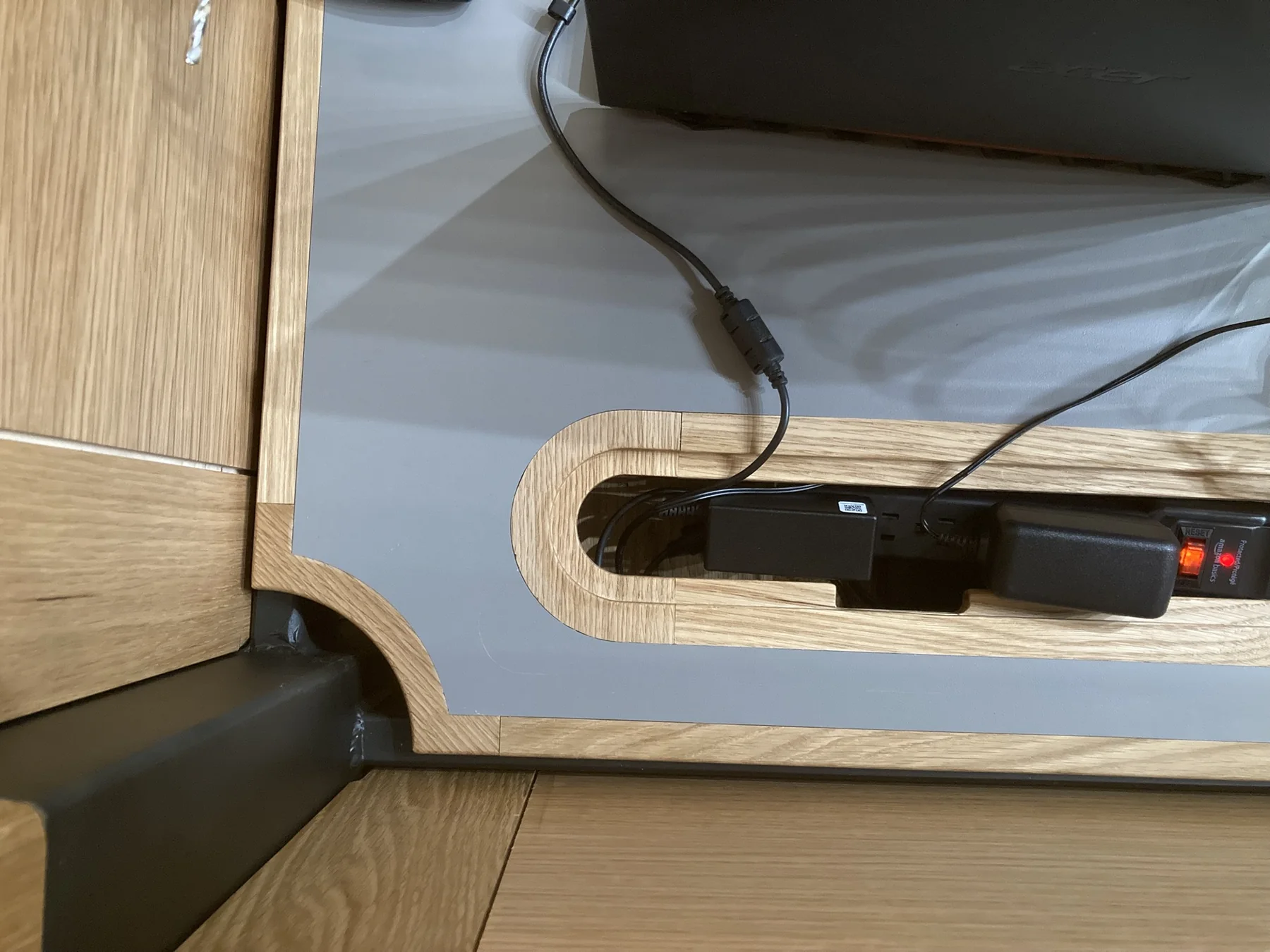 Routed White Oak cable opening built into the work surface