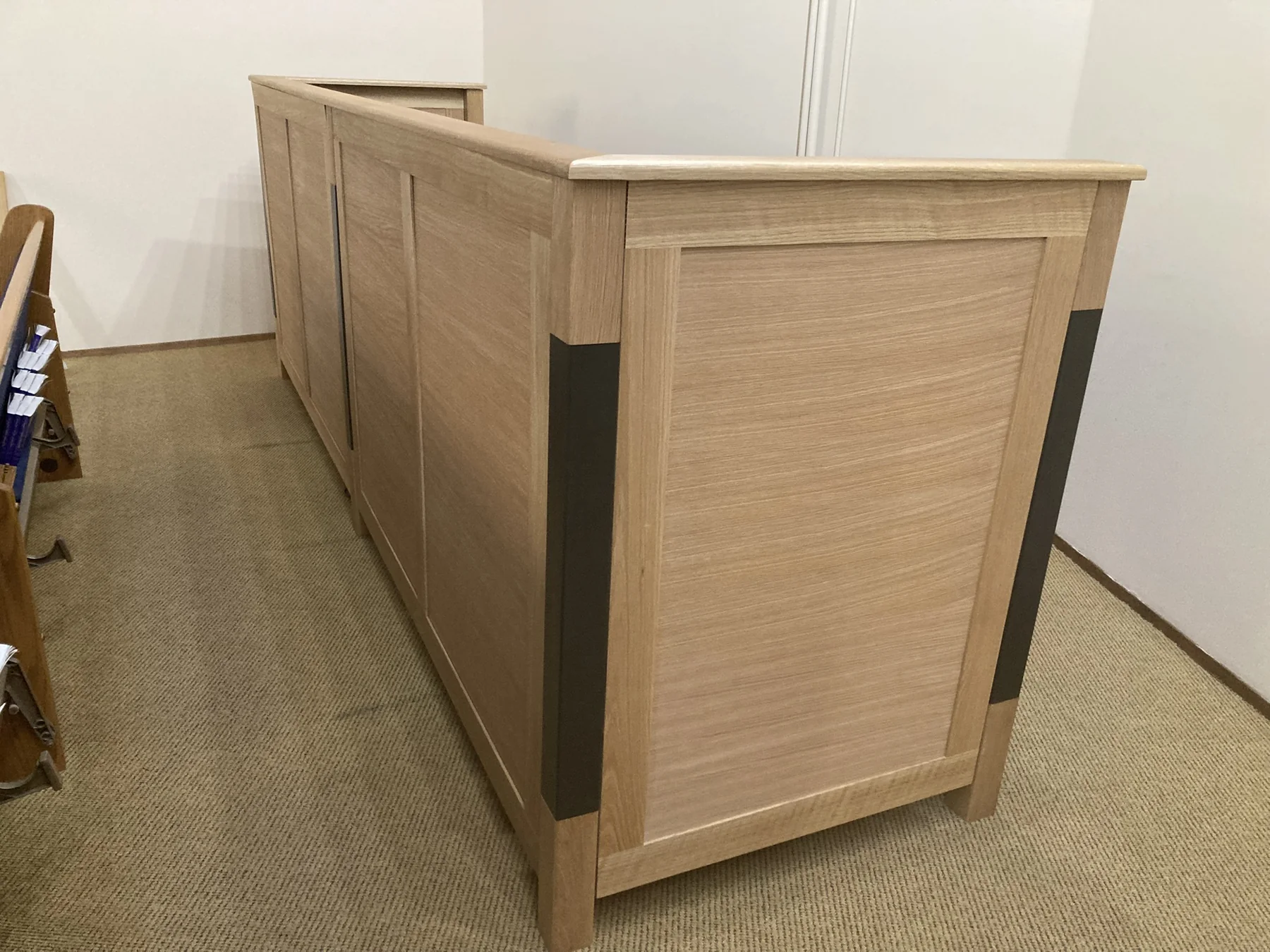 End of the White Oak console showing framed panels and dark inlays