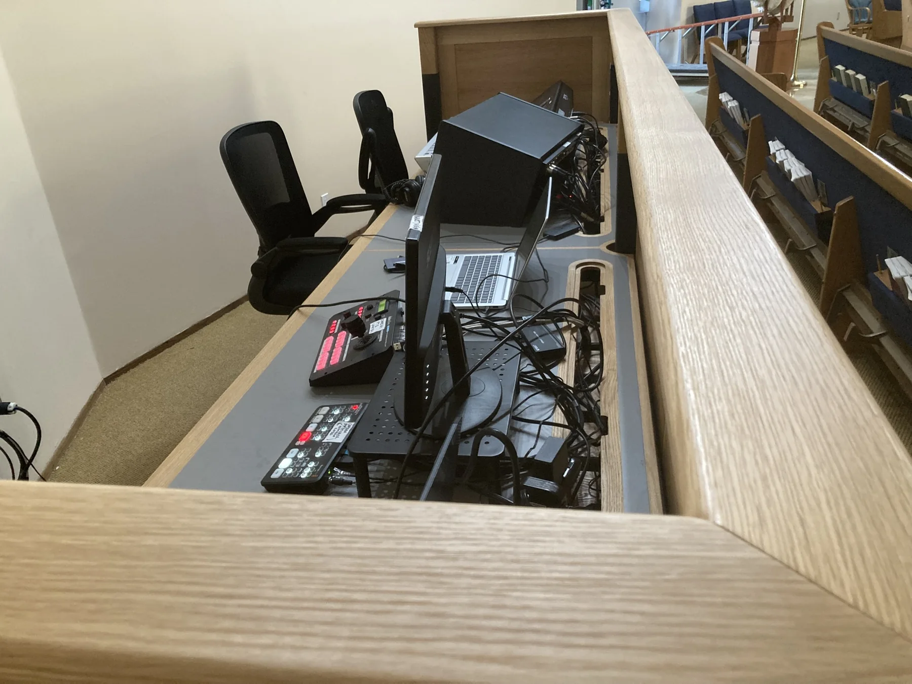 Operator side of the fitted media console showing equipment openings