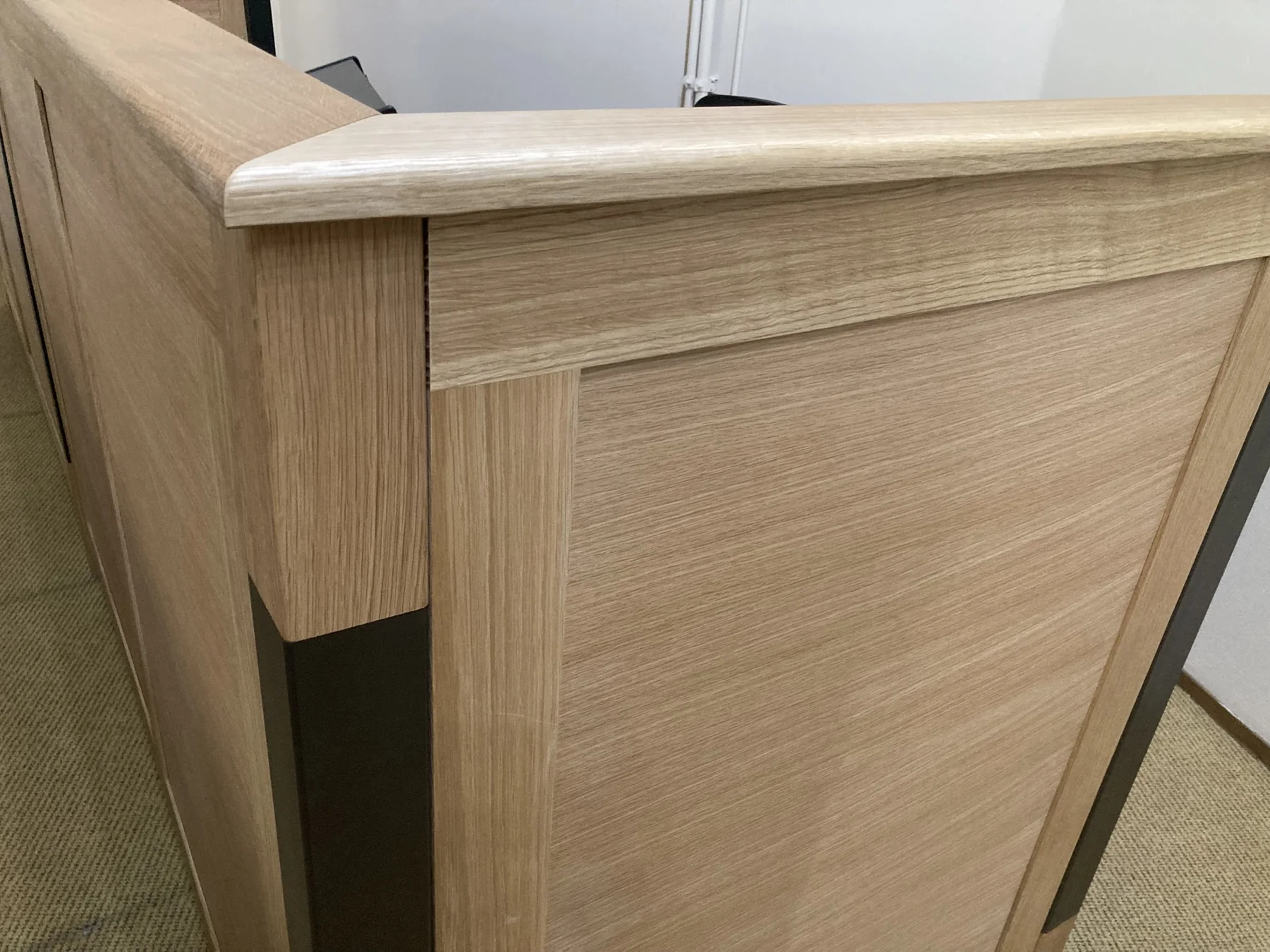 Rounded solid White Oak counter edge above a framed panel